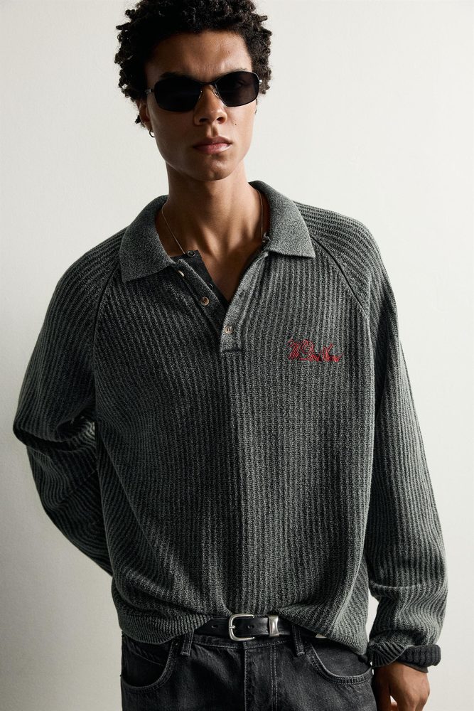 Dark relaxed knit shirt with a button front.
