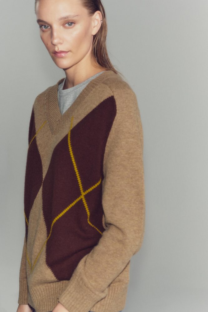 Brown and burgundy argyle V-neck sweater.