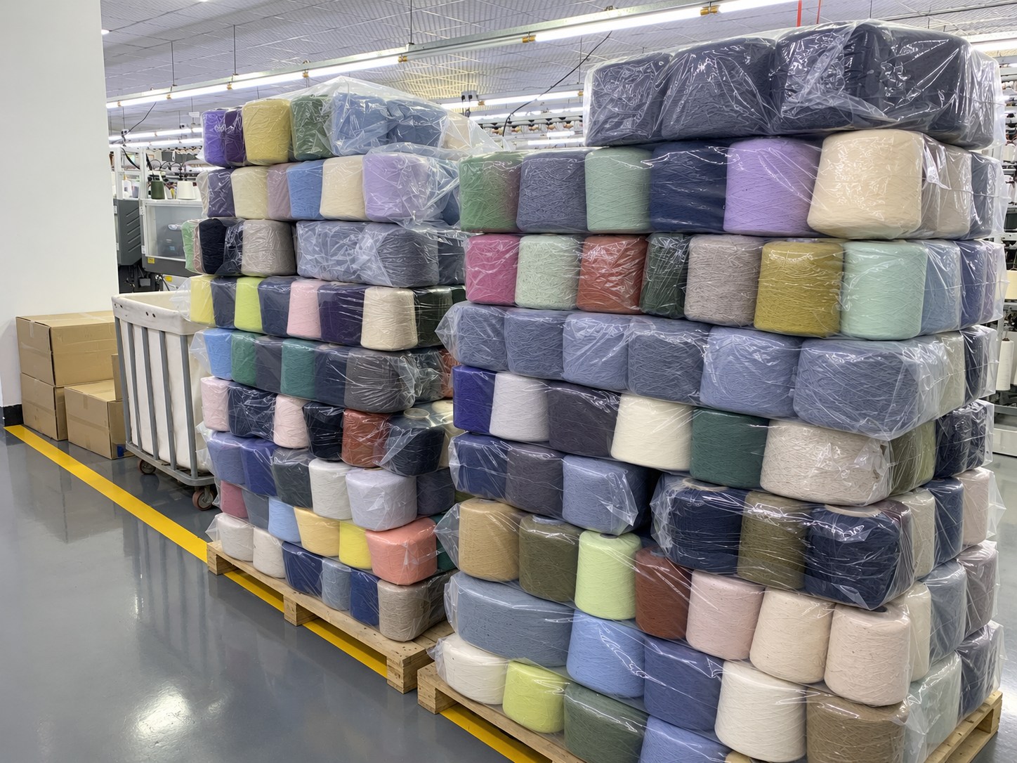 Packaged yarn cones in different colours