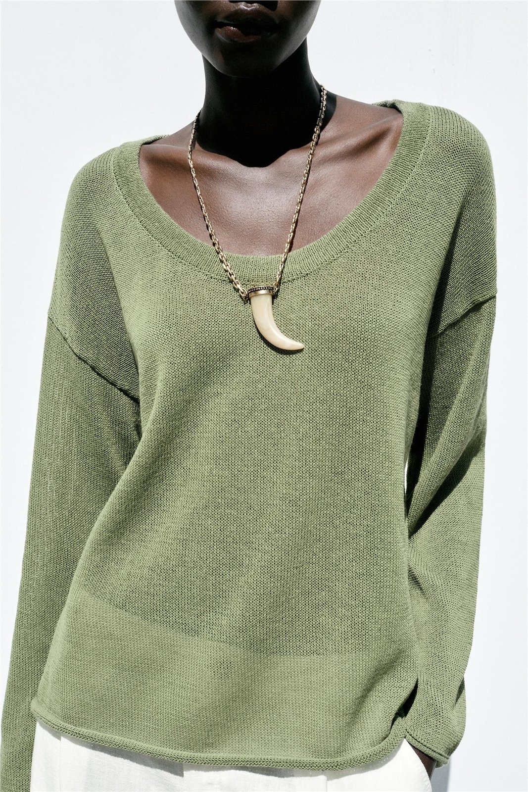Relaxed V-Neck Knit Top — knitwear style reference