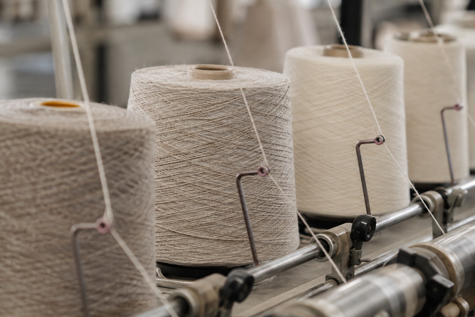 Editorial concept of yarn winding and thread guides.