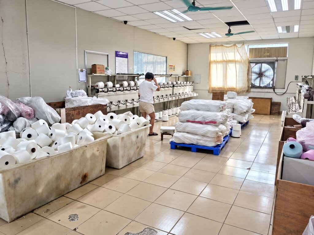 Yarn cones and material preparation at Wayhonk.